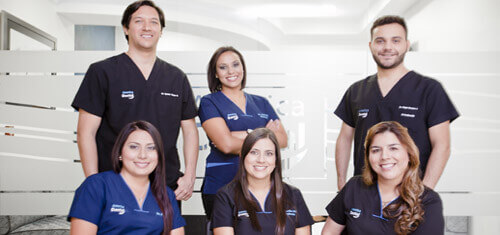 Picture of Premier Holistic dental specialists in Costa Rica. The picture shows six dental specialists from Premier Holistic Dental posing for a group picture.
